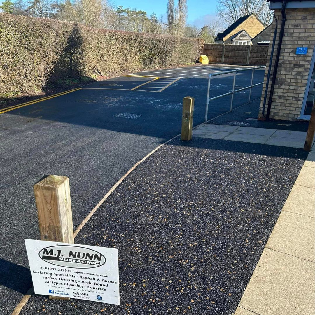 Resurfaced commercial car park with painted parking bays