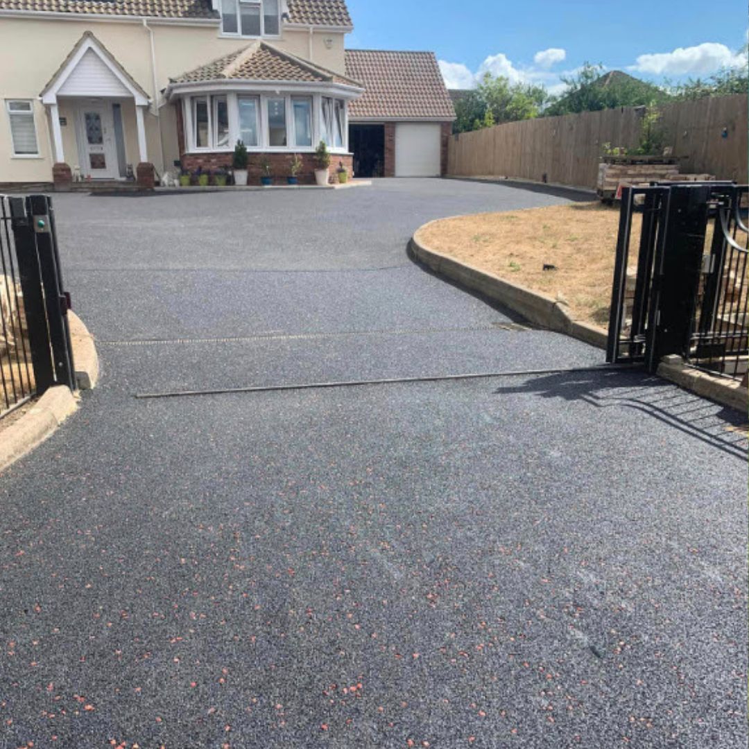 Renovated driveway with tarmac and block paved edging
